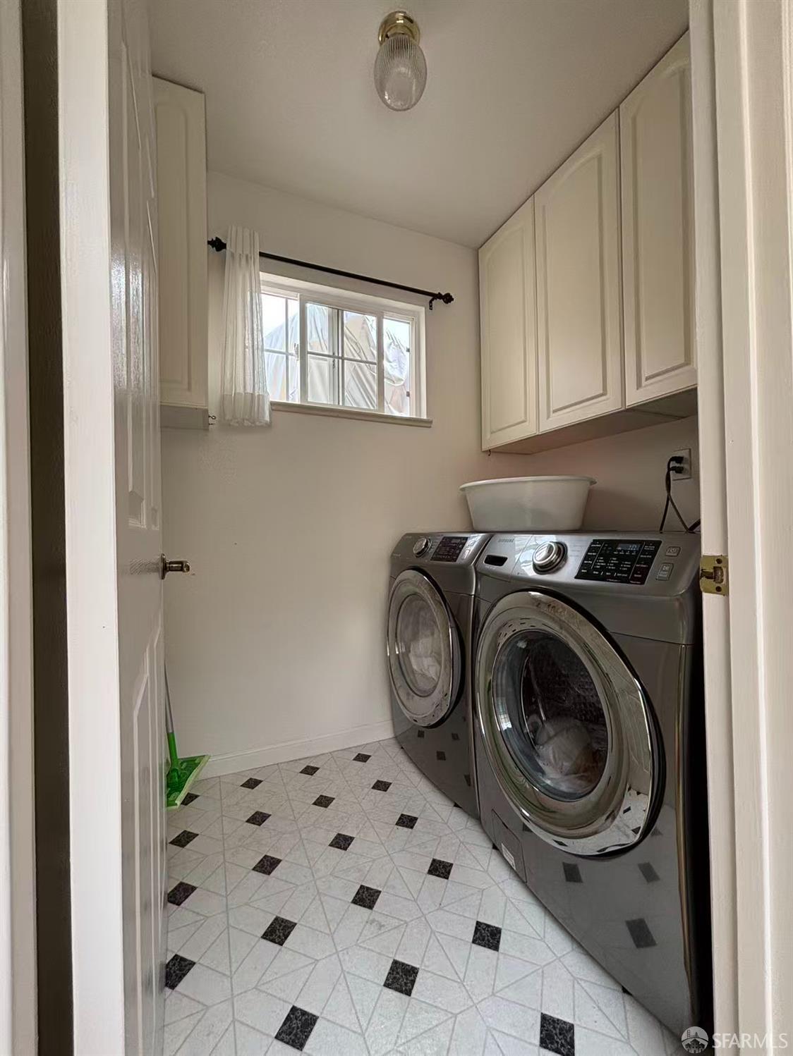 450 Laurel Avenue Millbrae, CA 94030 - Photo 24 of 27 a utility room with window dryer and washer