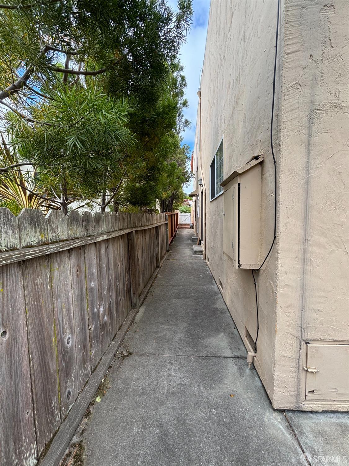 450 Laurel Avenue Millbrae, CA 94030 - Photo 25 of 27 a view of a pathway of a house with wooden fence