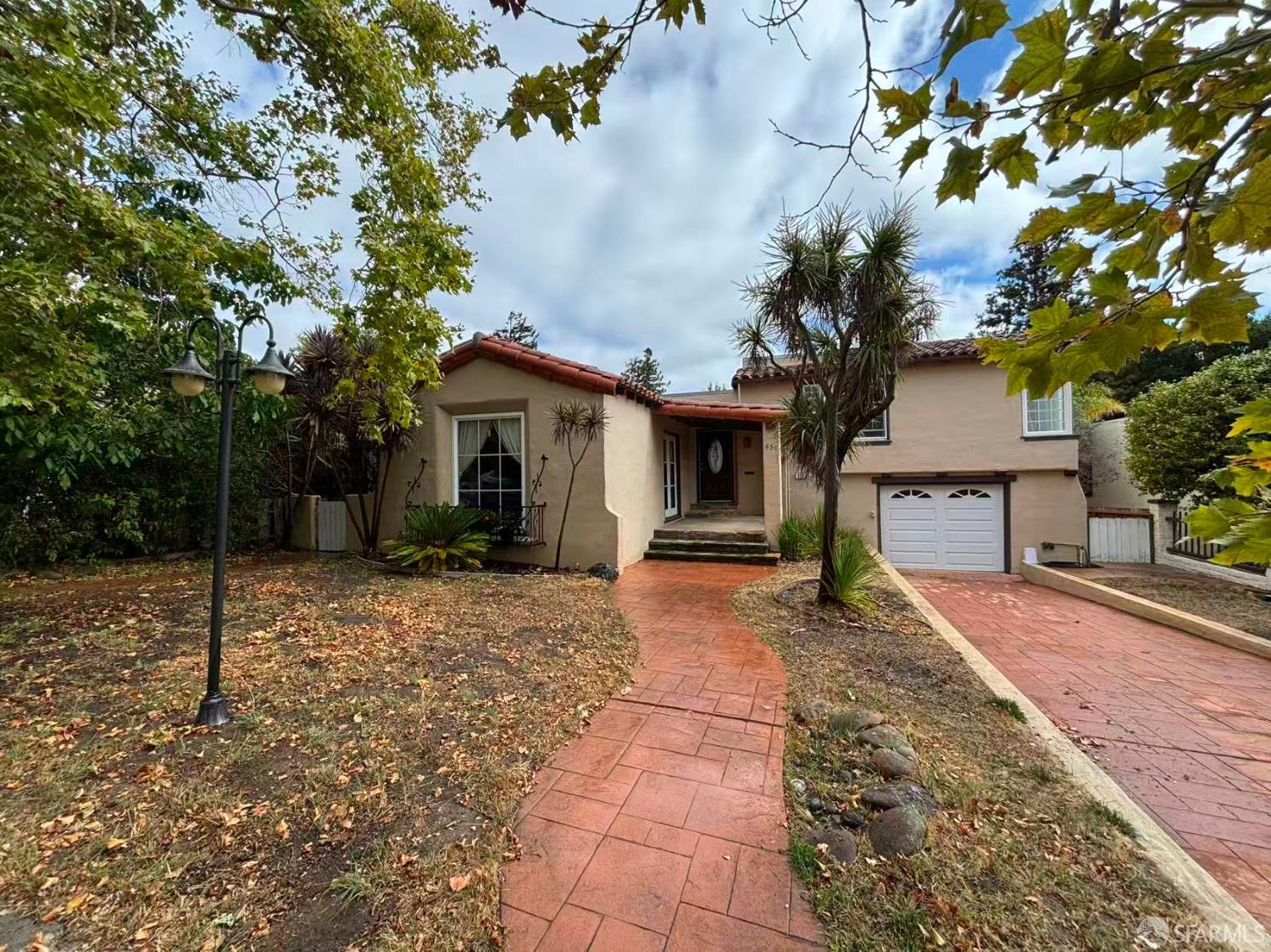 450 Laurel Avenue Millbrae, CA 94030 - Photo 26 of 27 a view of a house with a tree