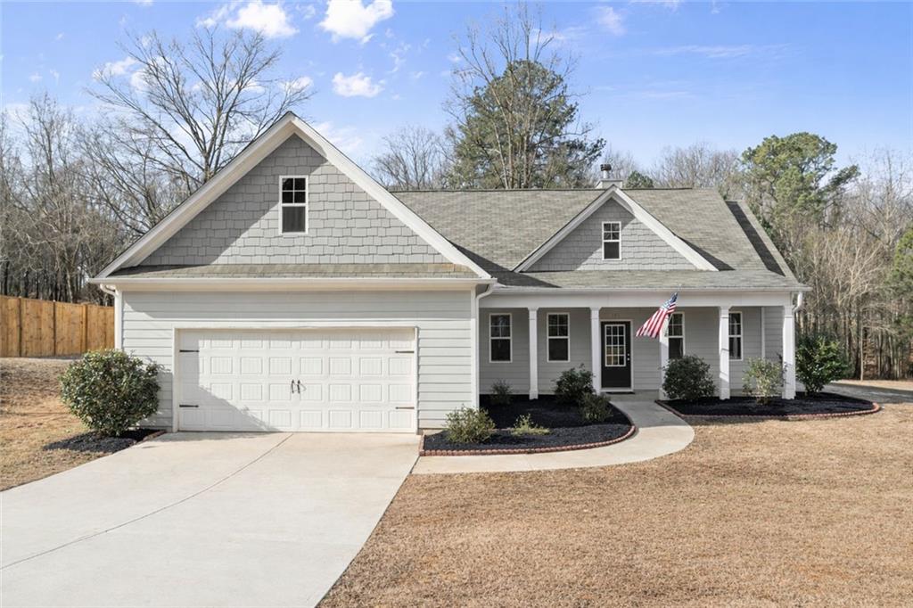 195 Cedar Drive Pendergrass, GA 30567 - Photo 1 of 1 a front view of a house with a yard and garage