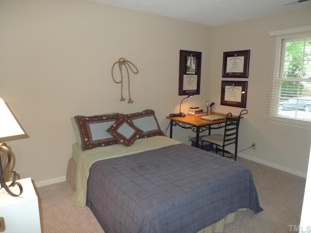 2901 Wycliff Road Raleigh, NC 27607 - Photo 7 of 10 a bedroom with a bed and a window
