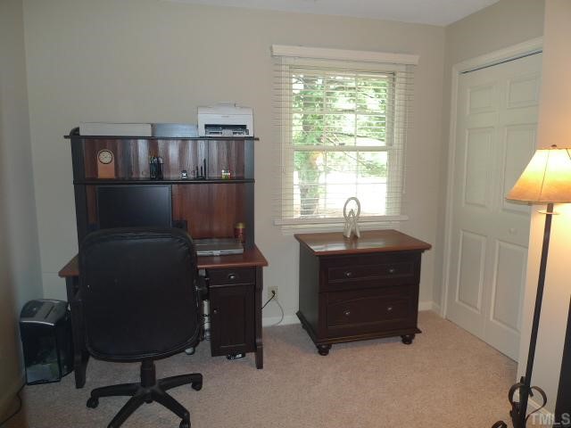 2901 Wycliff Road Raleigh, NC 27607 - Photo 8 of 10 a room with furniture and a window