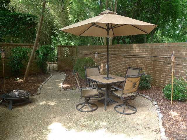 2901 Wycliff Road Raleigh, NC 27607 - Photo 9 of 10 a view of a backyard with table and chairs under an umbrella