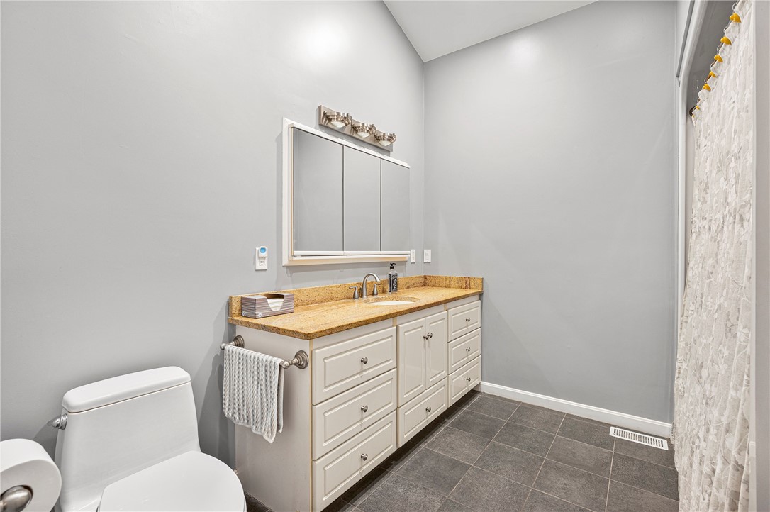 1967 Division Road East Greenwich, RI 02818 - Photo 16 of 38 First floor full bathroom with tub/shower, granite vanity and ceramic floor