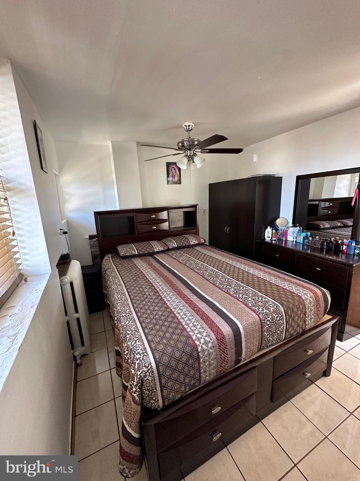 4914 Ormes Street Philadelphia, PA 19120 - Photo 11 of 33 a bedroom with bed and wooden floor