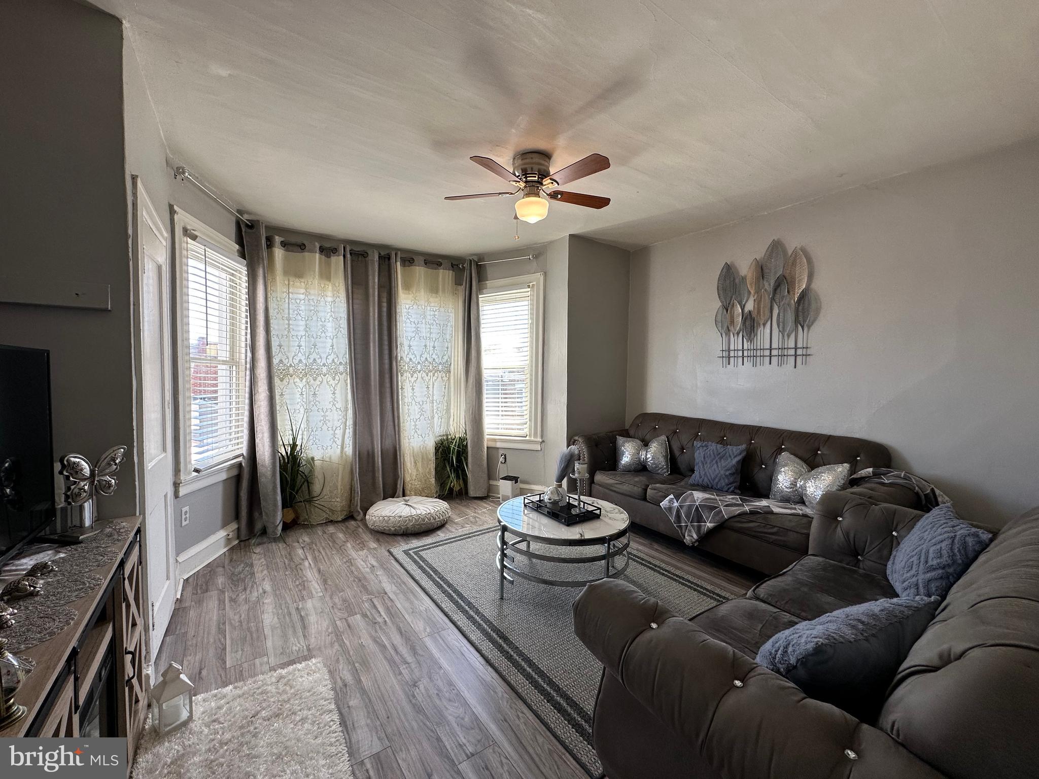 4914 Ormes Street Philadelphia, PA 19120 - Photo 14 of 33 a living room with furniture and a flat screen tv
