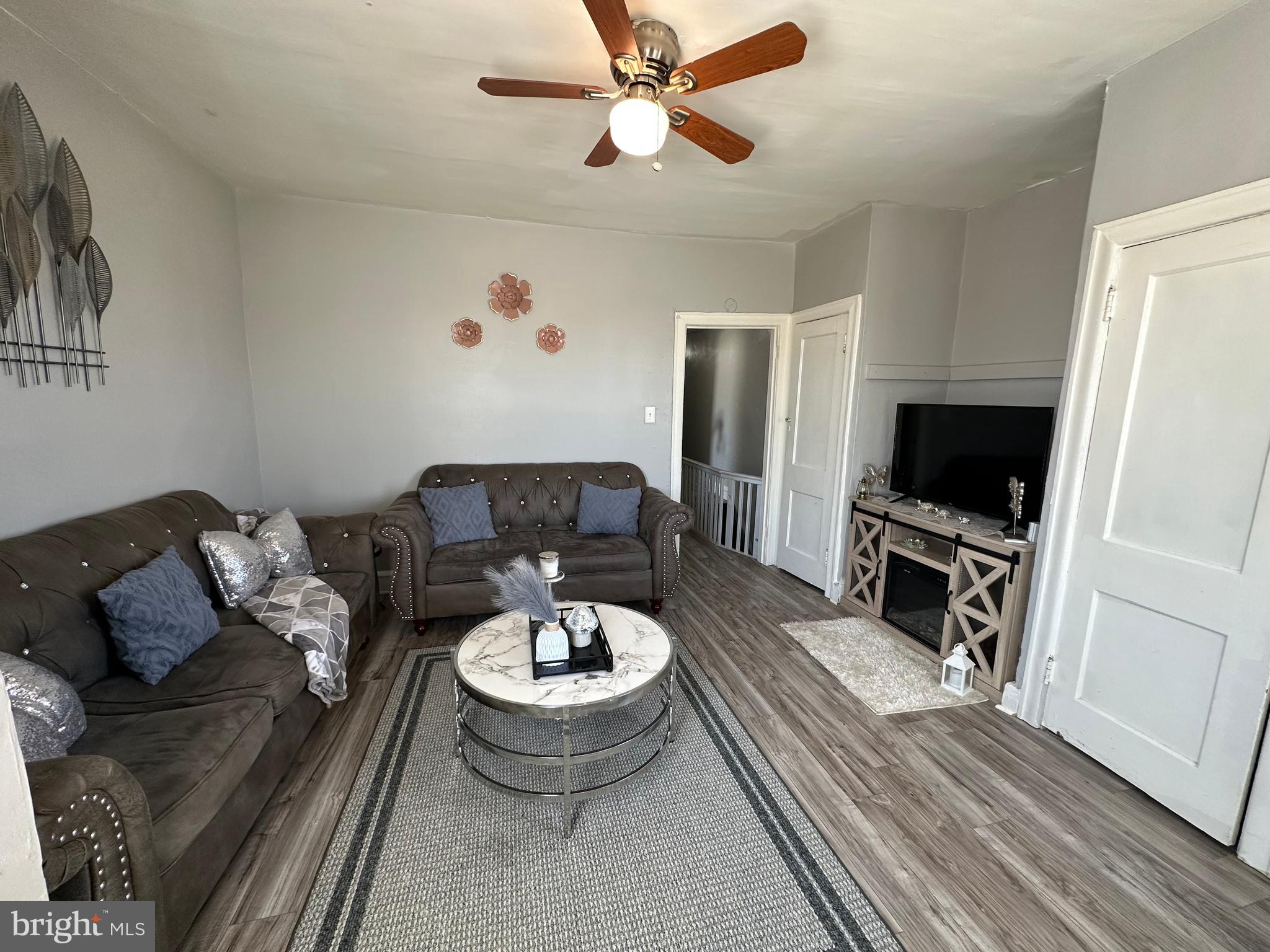4914 Ormes Street Philadelphia, PA 19120 - Photo 15 of 33 a living room with furniture and a flat screen tv