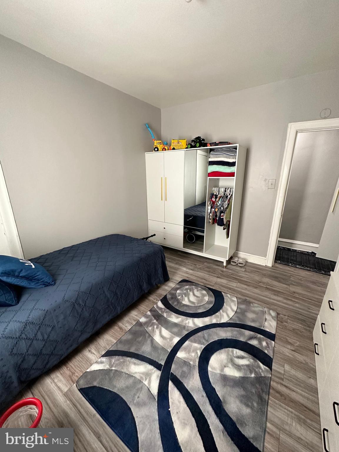 4914 Ormes Street Philadelphia, PA 19120 - Photo 18 of 33 a living room with furniture and a wooden floor