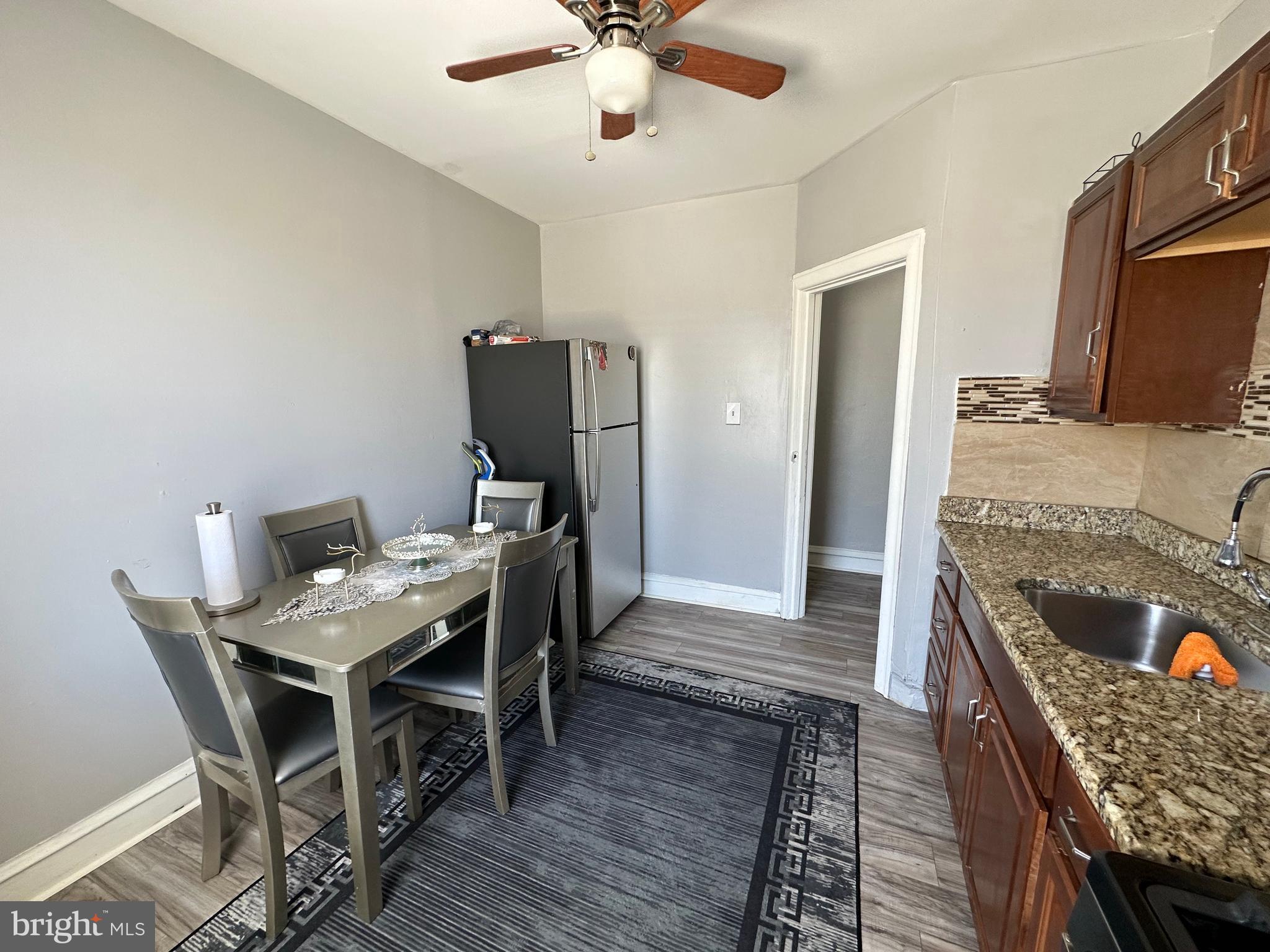 4914 Ormes Street Philadelphia, PA 19120 - Photo 26 of 33 a workspace with furniture and wooden floor