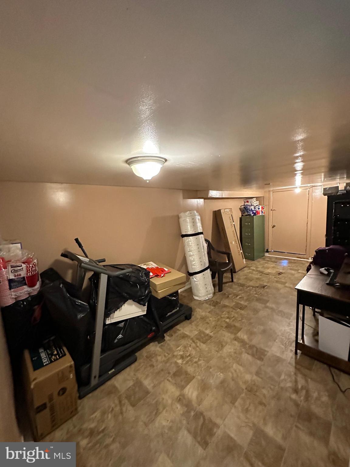 4914 Ormes Street Philadelphia, PA 19120 - Photo 29 of 33 a gym room with furniture and a lamp