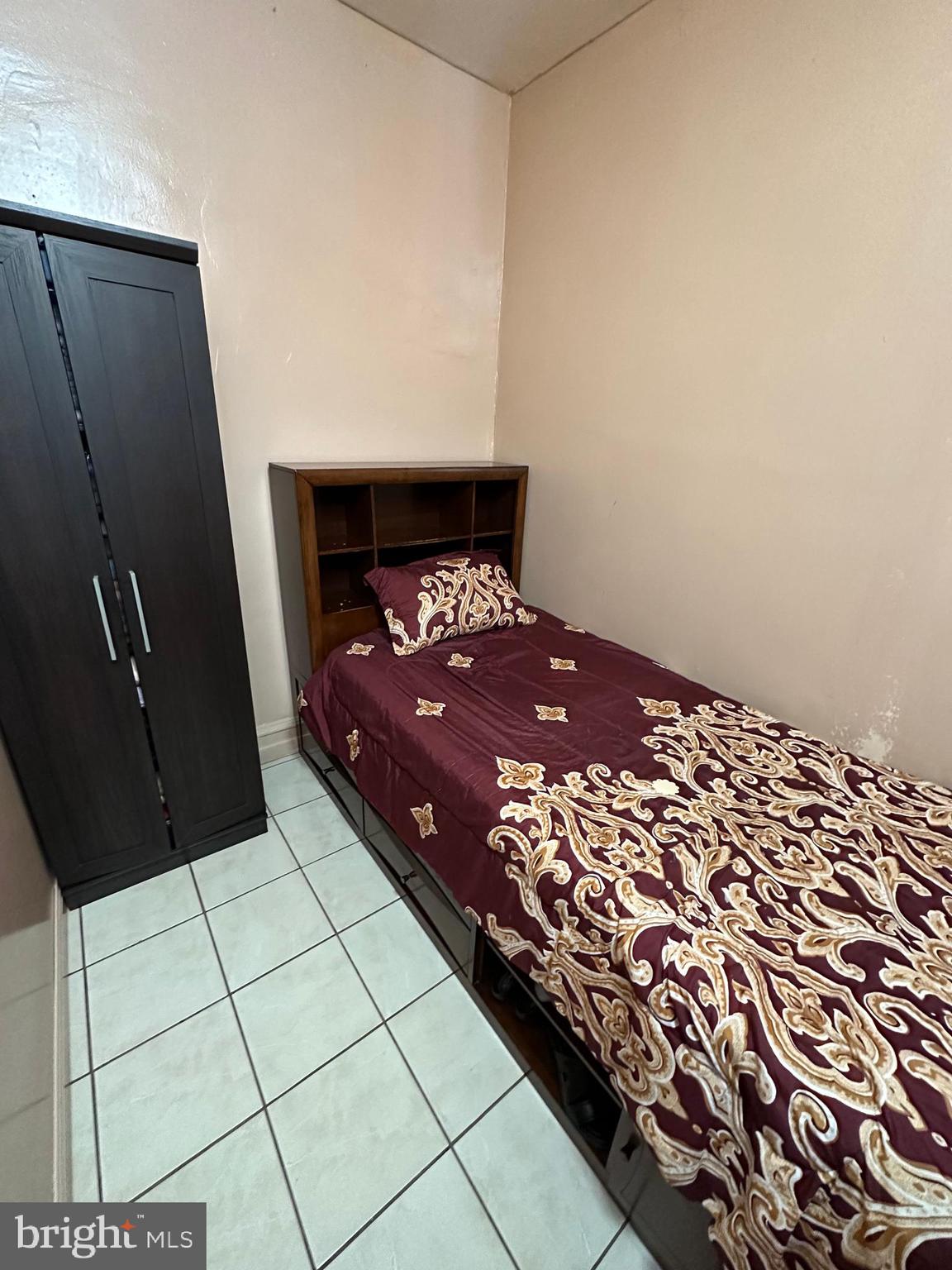 4914 Ormes Street Philadelphia, PA 19120 - Photo 9 of 33 a bedroom with a bed and a dresser