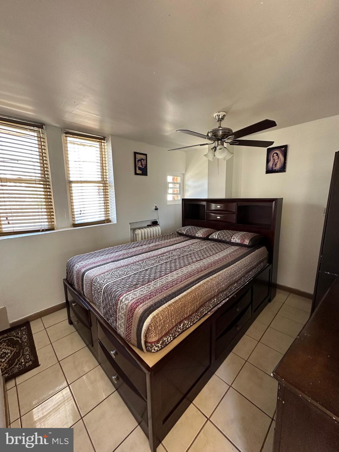 4914 Ormes Street Philadelphia, PA 19120 - Photo 10 of 33 a bedroom with a bed and window