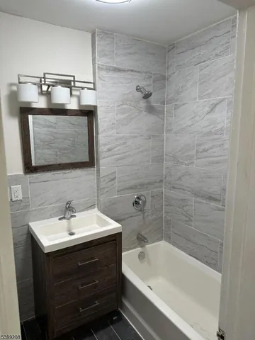 a kitchen with stainless steel appliances a refrigerator a stove a microwave and cabinets