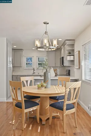 a dining room with furniture and window