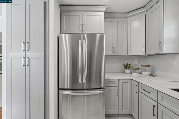 a kitchen with appliances and cabinets