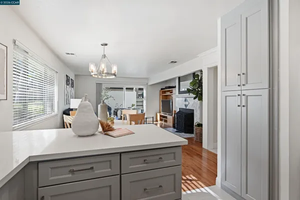 a kitchen with a refrigerator and a sink