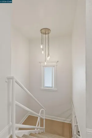 a bedroom with bed and a window