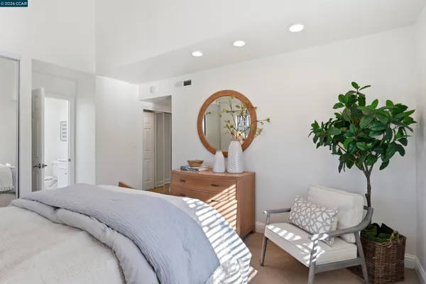 a en suite bathroom with a sink and a mirror