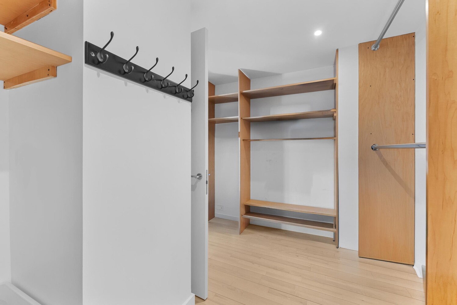 322 West 57th Street, Unit 39K Manhattan, NY 10019 - Photo 7 of 23 a view of walk in closet with empty racks