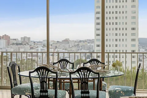 a view of a balcony with chairs