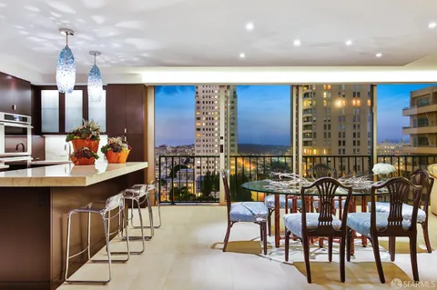 a bedroom with a large bed and a balcony view