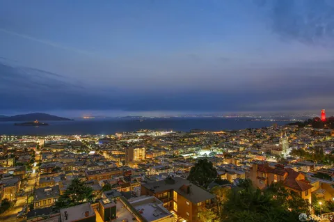 an aerial view of city and lake