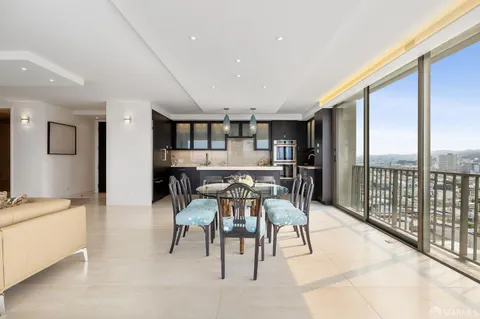 a view of a dining room with furniture window and outside view