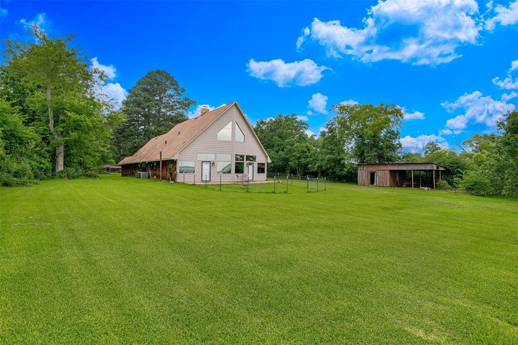 10307 Pirogue Road Oil City, LA 71061 - Photo 32 of 36 a view of a house with a yard