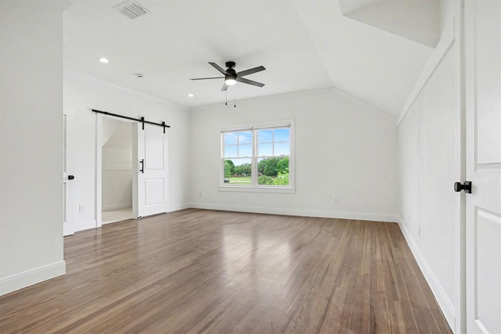 3923 Ranch Estates Circle Plano, TX 75074 - Photo 24 of 32 wooden floor in an empty room with a window
