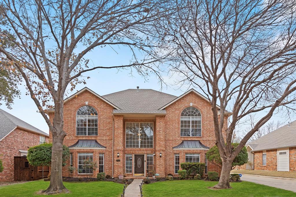 3203 Willow Ridge Trail Carrollton, TX 75007 - Photo 1 of 1 front view of a brick house with a yard
