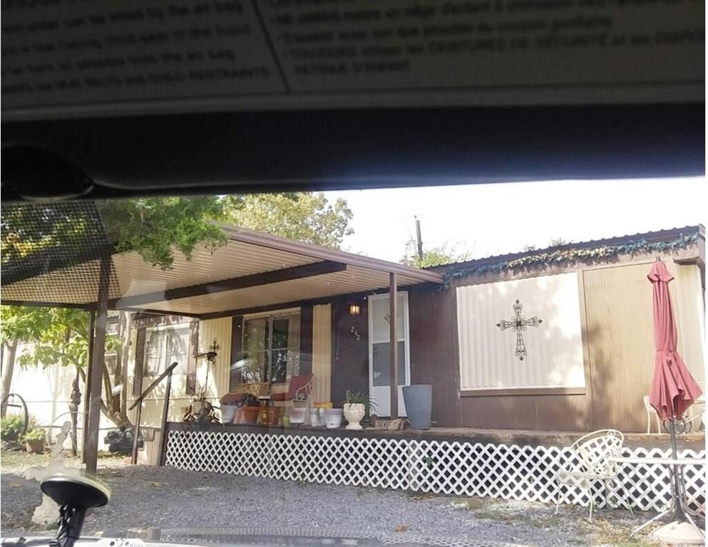 a front view of a house with a large window