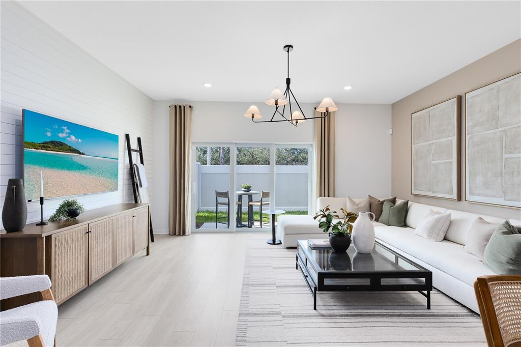 4445 Jetty Lane Palm Bay, FL 32905 - Photo 12 of 32 a living room with furniture and a chandelier