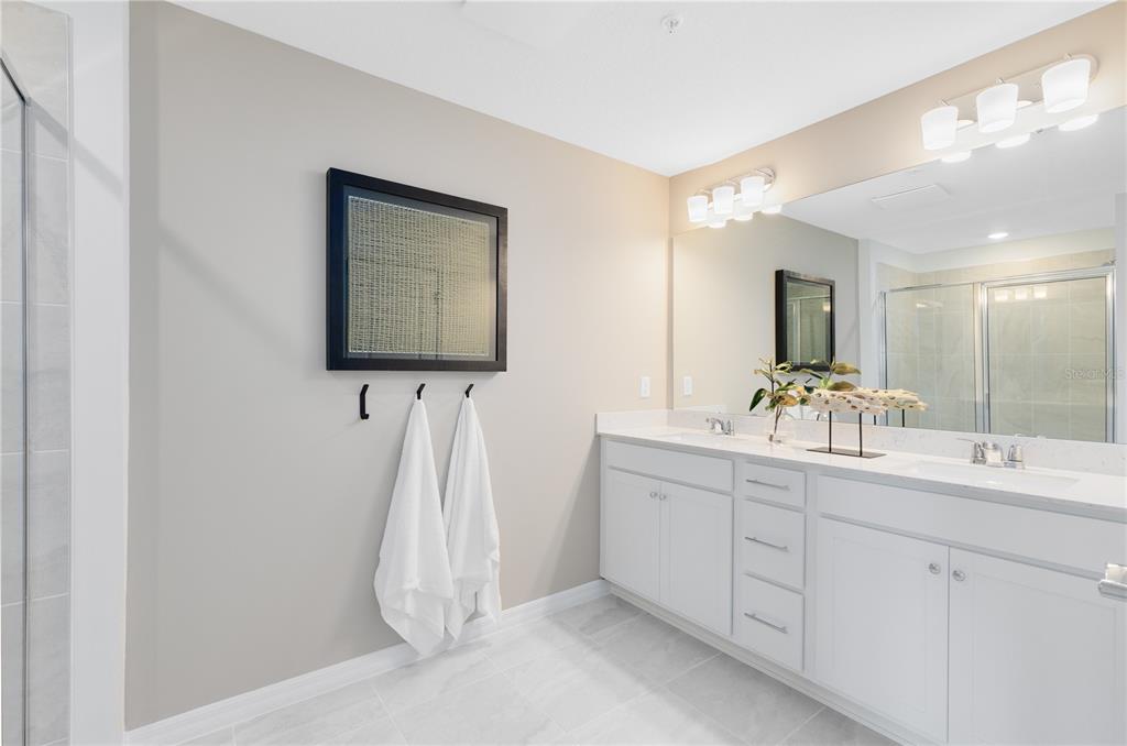 4445 Jetty Lane Palm Bay, FL 32905 - Photo 22 of 32 a bathroom with a sink and a mirror