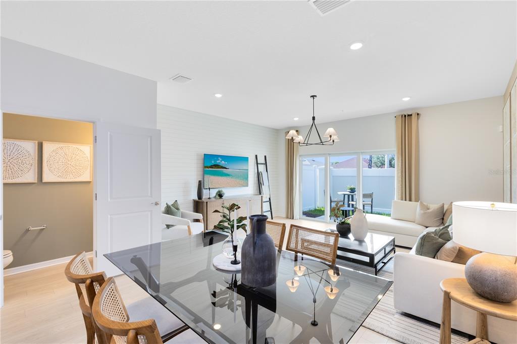 4445 Jetty Lane Palm Bay, FL 32905 - Photo 9 of 32 a view of a dining room with furniture window and wooden floor