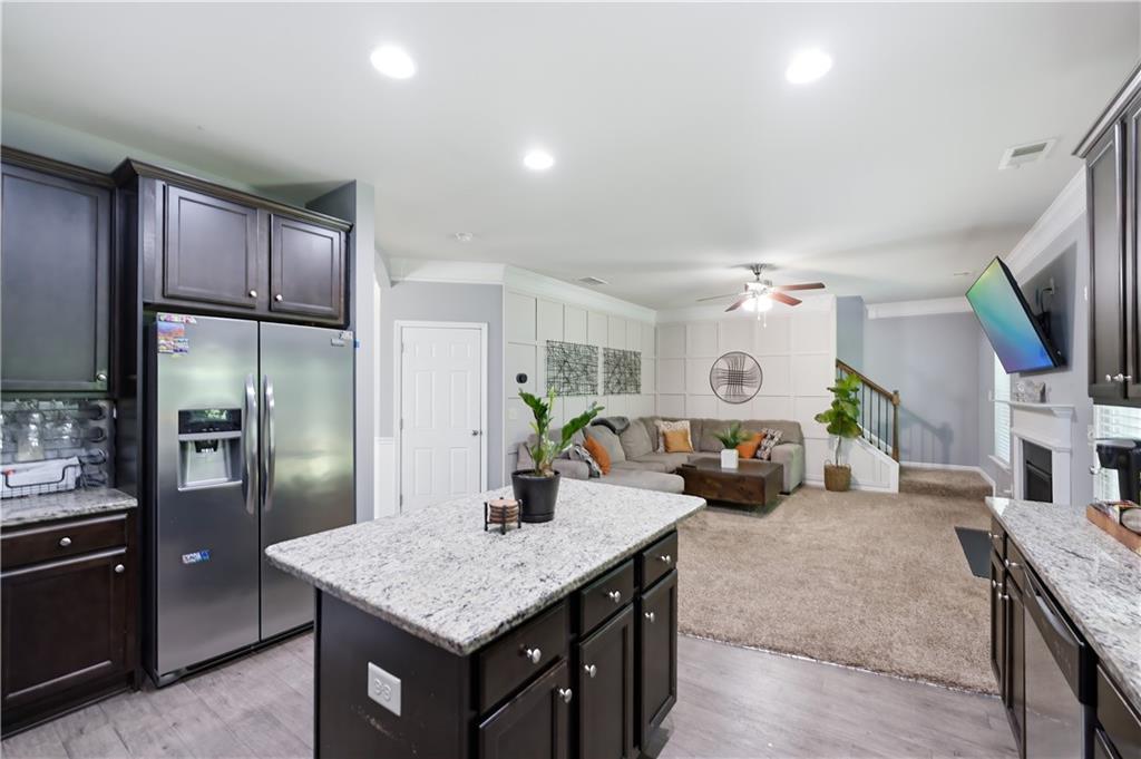 291 Boulder Run Hiram, GA 30141 - Photo 16 of 46 a kitchen with granite countertop a counter space and stainless steel appliances