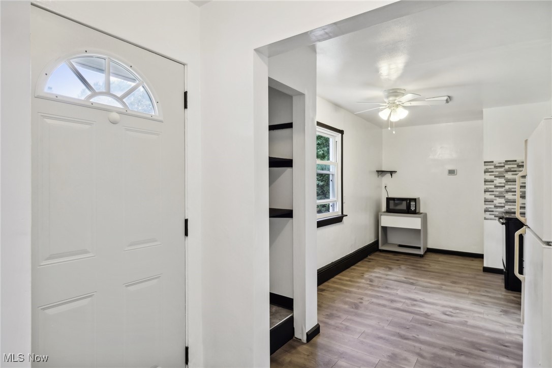 1829 Clyde Road Madison, OH 44057 - Photo 22 of 40 Entryway featuring hardwood / wood-style floors and ceiling fan
