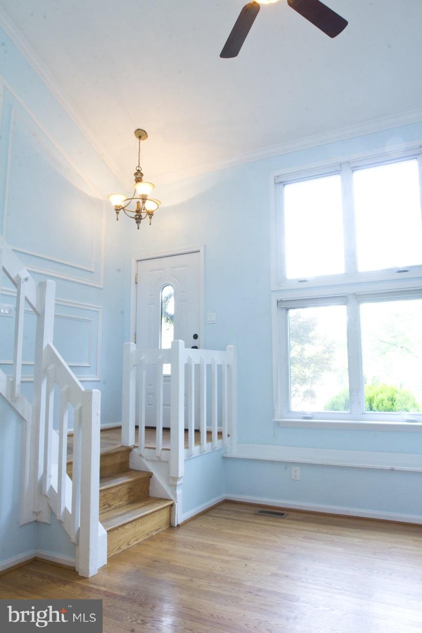 680 Red Cedar Road Annapolis, MD 21409 - Photo 18 of 30 a view of an empty room with wooden floor and a window