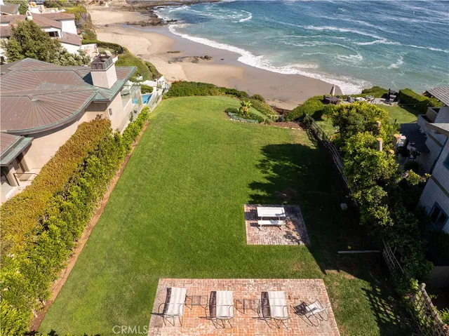 a view of a street with a building and trees in the background