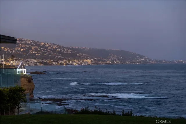 a view of a house next to a yard
