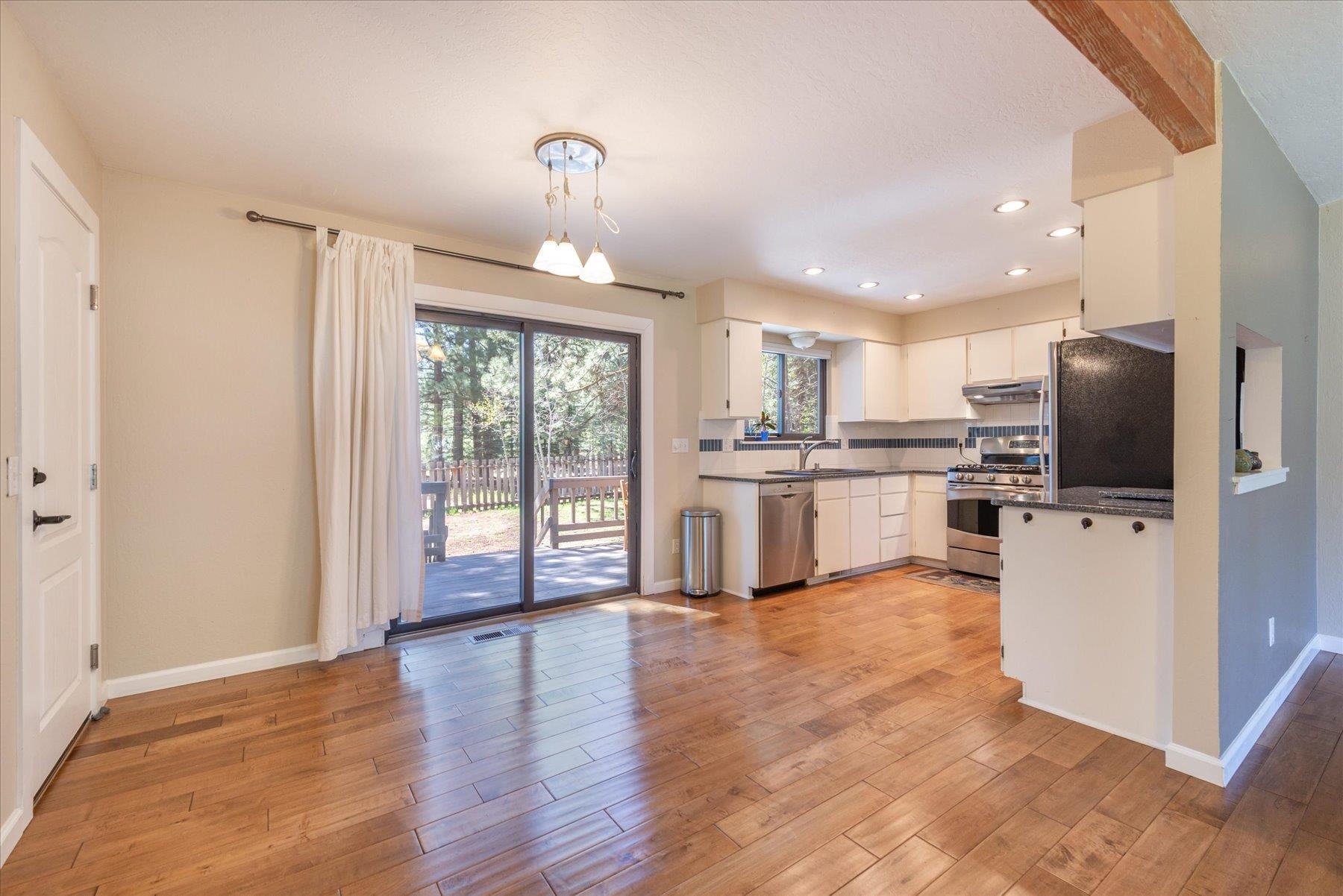 15844 Archery View Truckee, CA 96161 - Photo 11 of 26 a kitchen with stainless steel appliances granite countertop a refrigerator and a stove top oven
