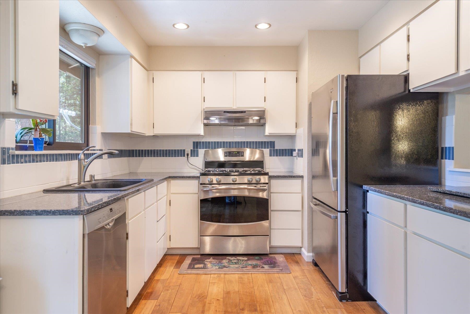 15844 Archery View Truckee, CA 96161 - Photo 12 of 26 a kitchen with stainless steel appliances a stove a sink and a refrigerator