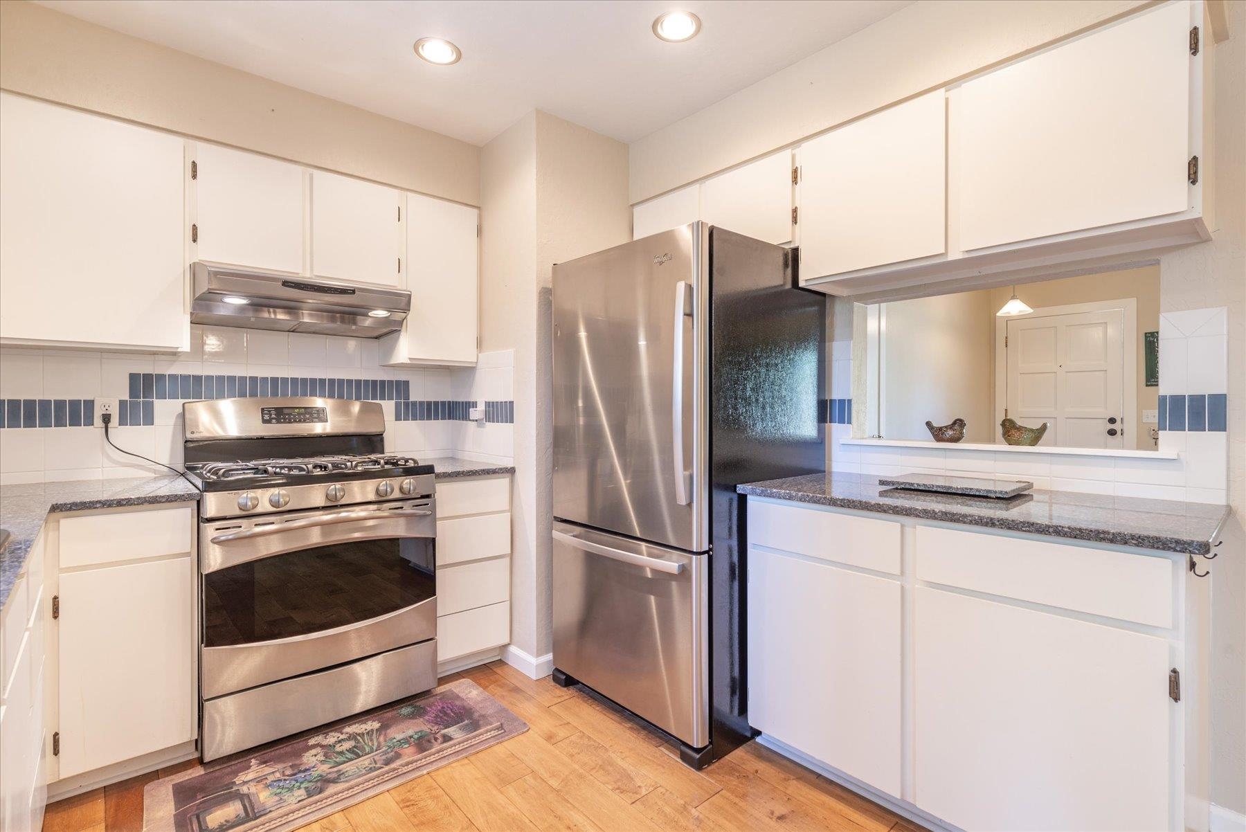 15844 Archery View Truckee, CA 96161 - Photo 14 of 26 a kitchen with stainless steel appliances granite countertop a stove a refrigerator and a refrigerator