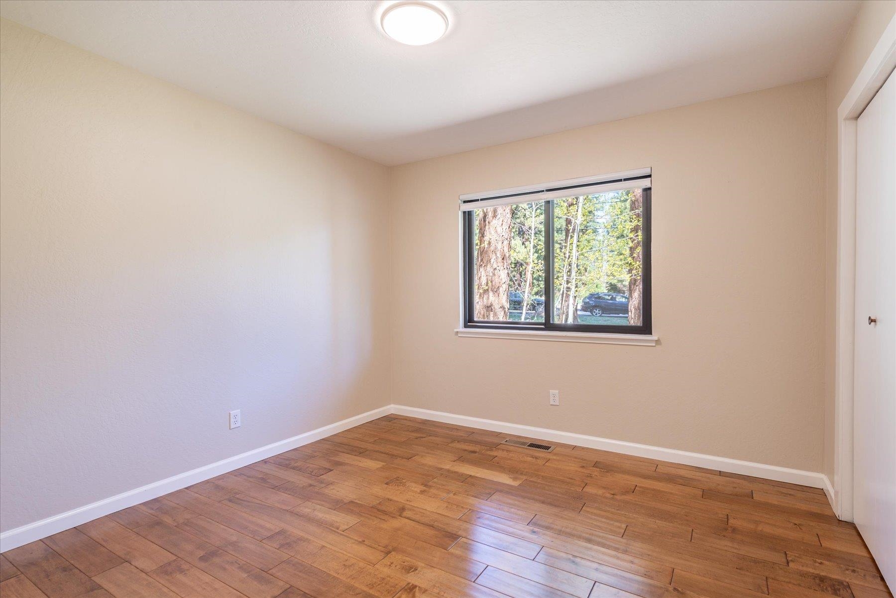 15844 Archery View Truckee, CA 96161 - Photo 16 of 26 wooden floor in an empty room with a window