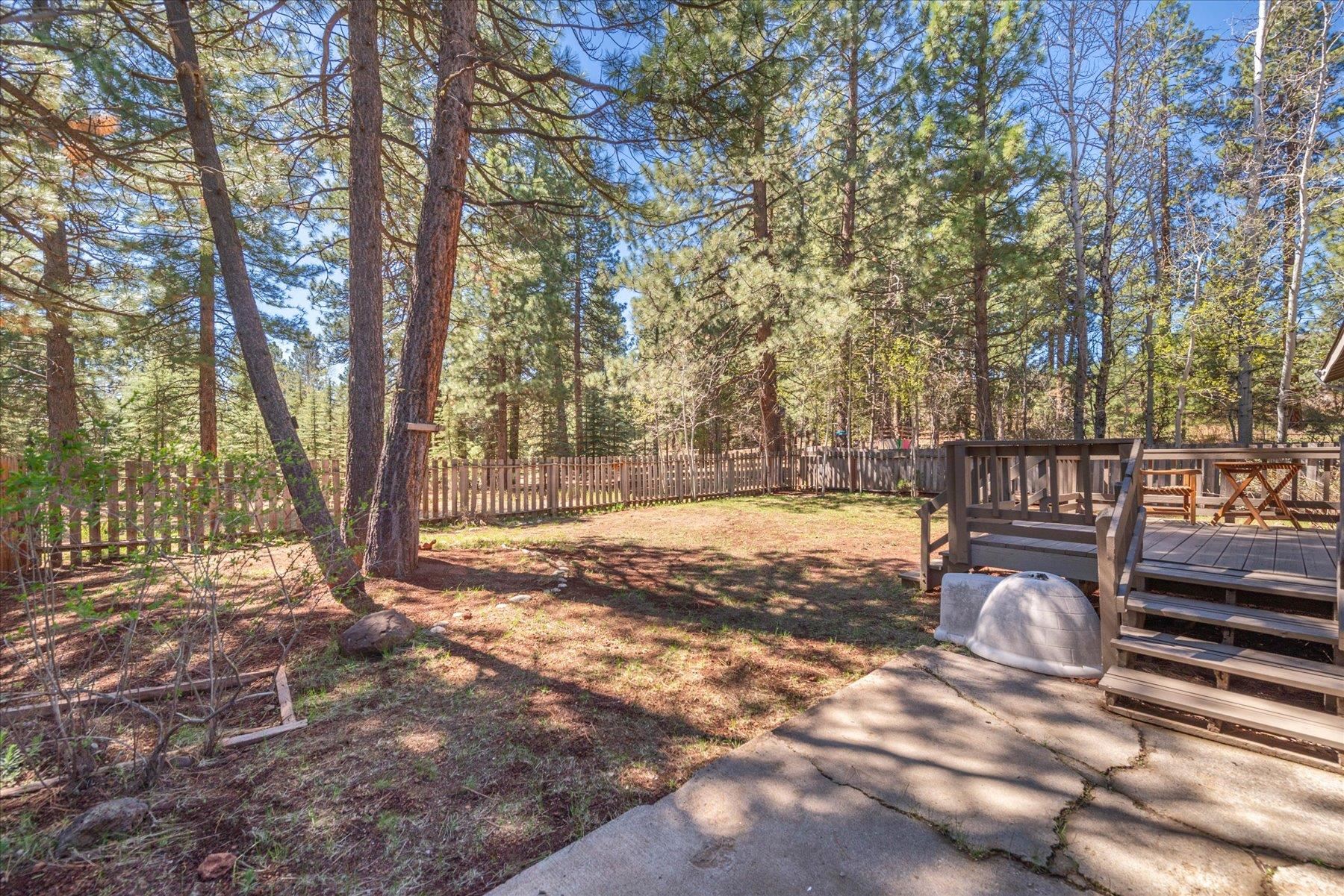 15844 Archery View Truckee, CA 96161 - Photo 24 of 26 a view of a yard with wooden fence and large trees