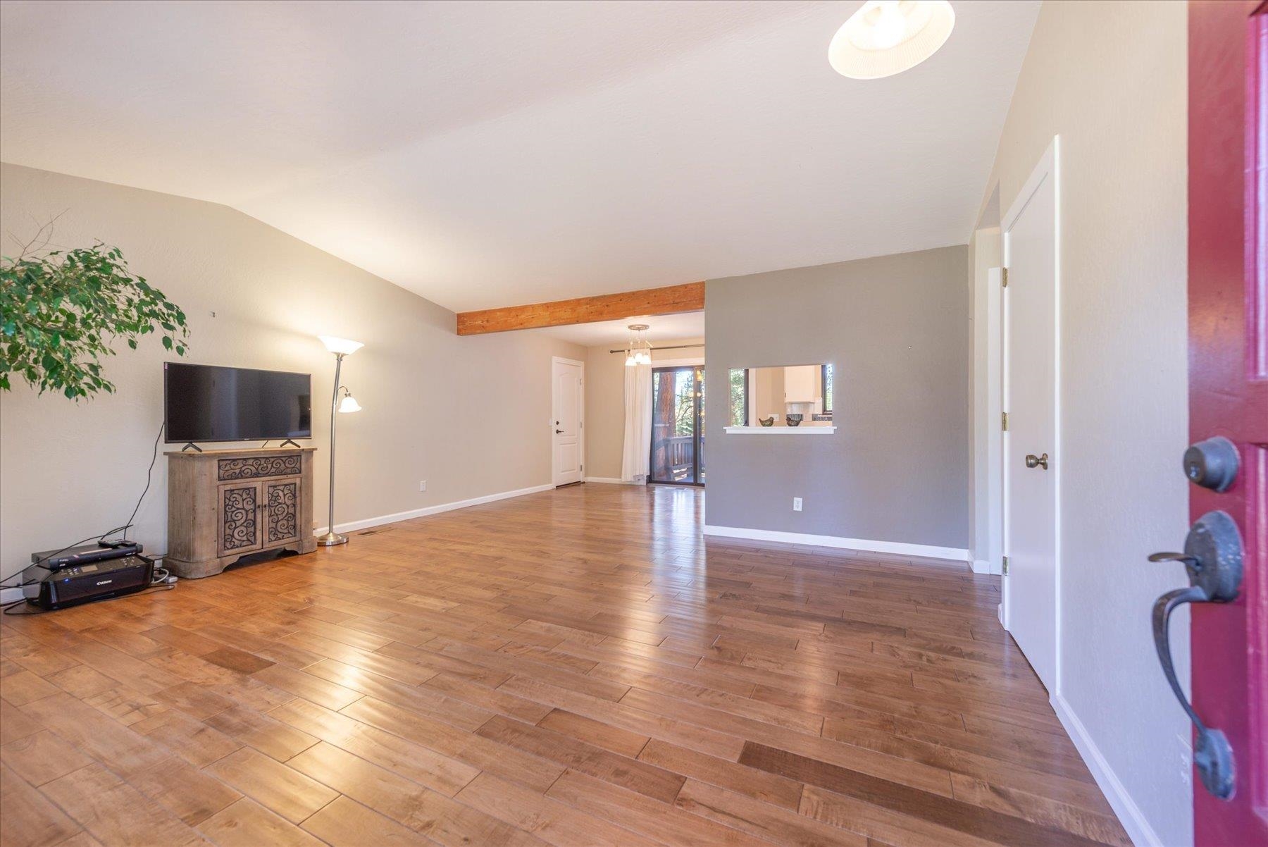 15844 Archery View Truckee, CA 96161 - Photo 6 of 26 a view of an empty room with wooden floor and a potted plant