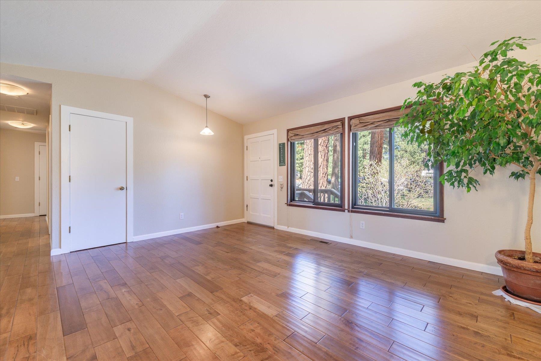 15844 Archery View Truckee, CA 96161 - Photo 9 of 26 a view of an empty room with a window and wooden floor