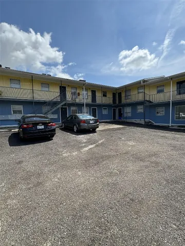 a view of street with parked cars