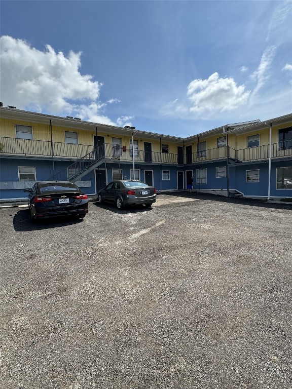a view of street with parked cars