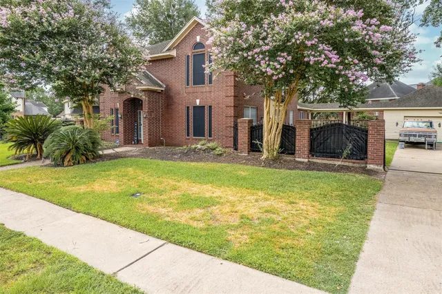 a swimming pool with outdoor seating and yard