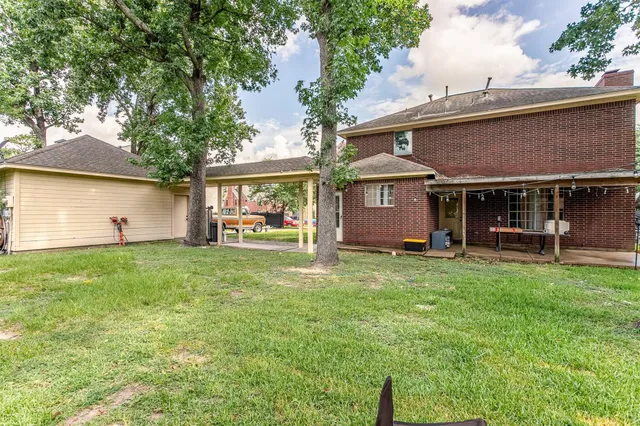 front view of a house with a garden